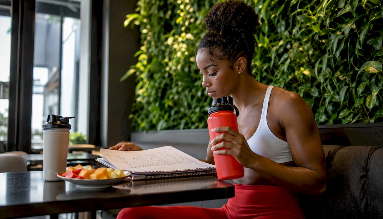 Athlete planning recovery with hydration and nutrition