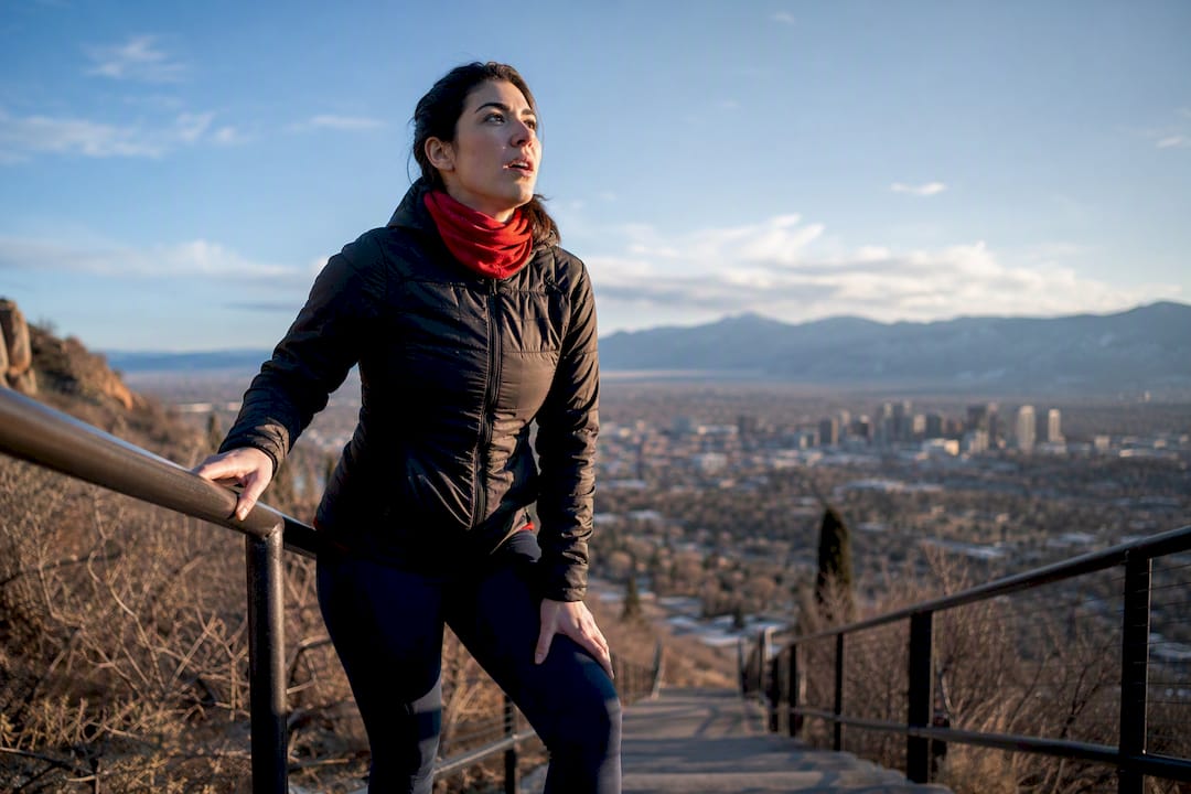 Visitor pausing on Denver hillside stairs
