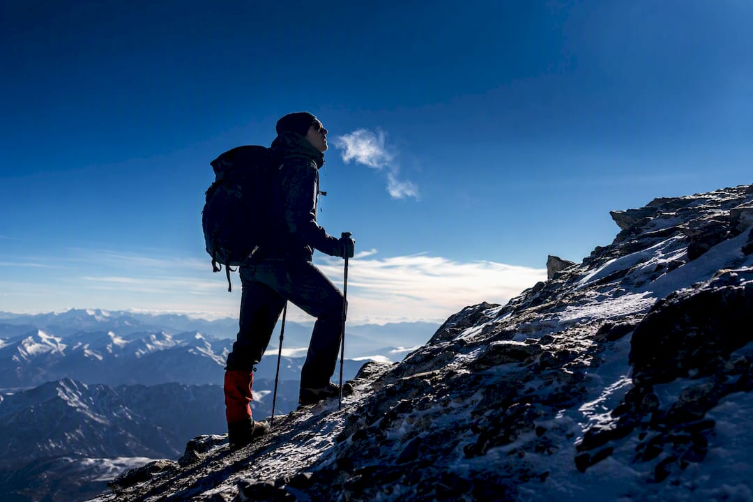 Climber breathing on a high alpine ridge
