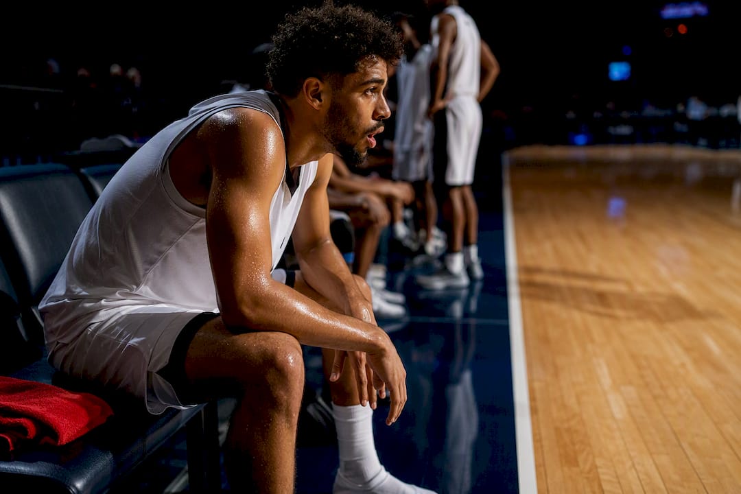 Basketball player recovering during timeout