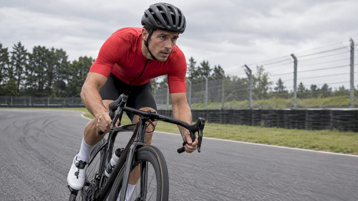 Road cyclist riding hard on a circuit