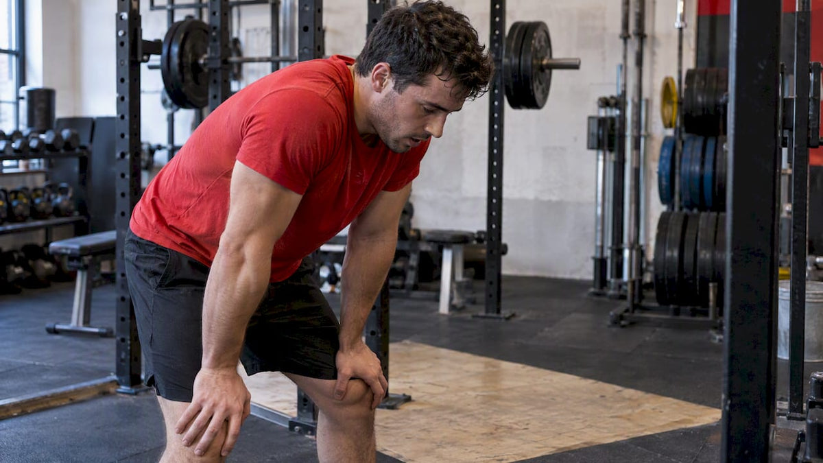 Athlete catching his breath after strength training